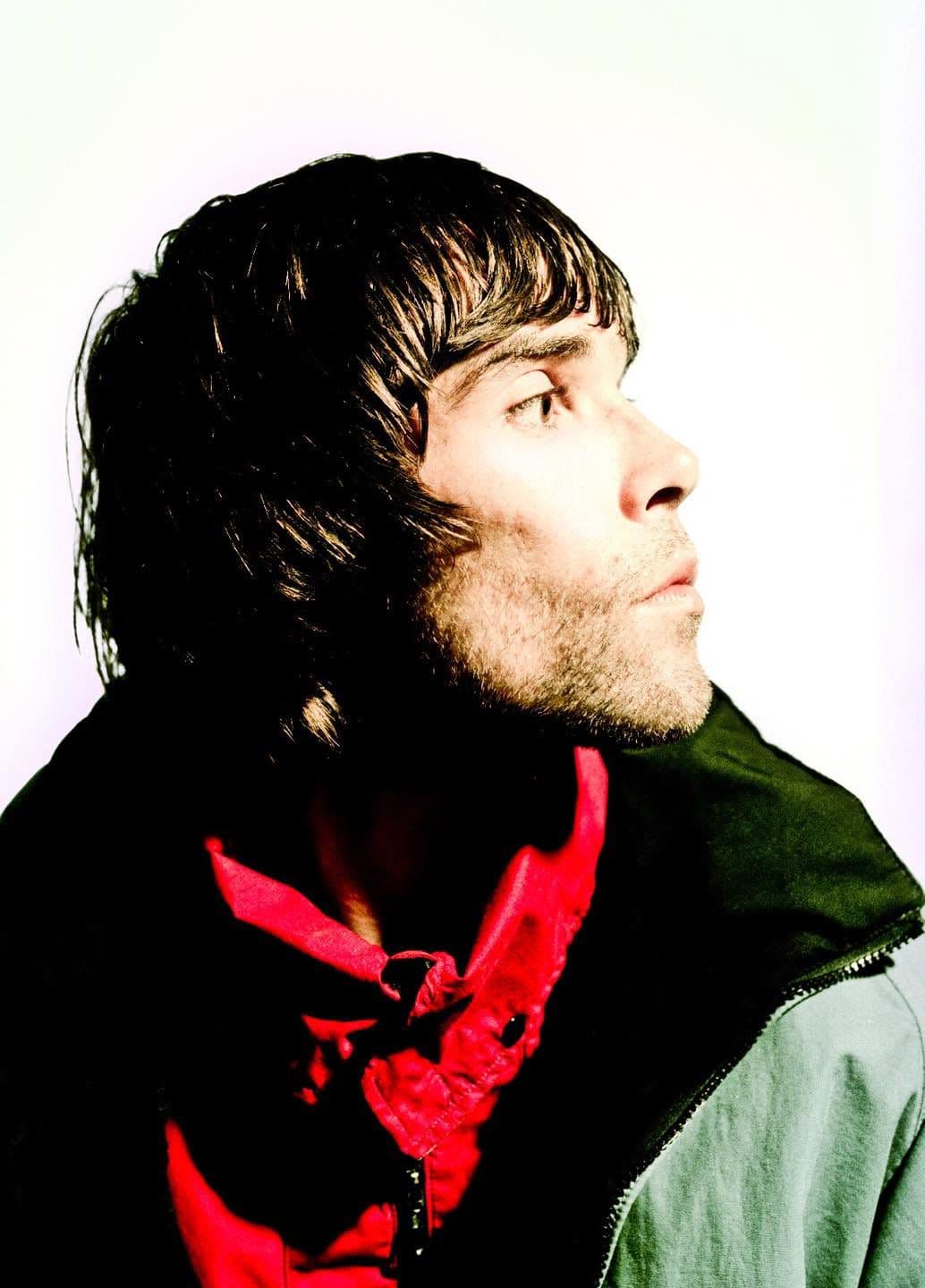 Ian Brown of The Stone Roses in profile, red scarf at his neck.